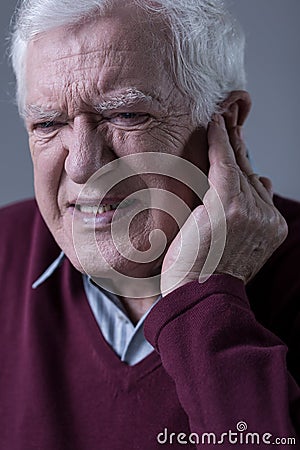 Man with earache Stock Photo