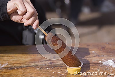 [Image: man-eating-corndog-11351118.jpg]