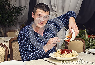 Man eating a large portion of pasta Stock Photo