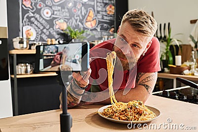 Man Eating Pasta On Camera Stock Photo