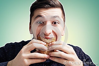 Man eating a sandwich with violent impetuosity Stock Photo
