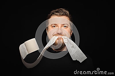 Man eating toilet paper. Hunger strike Stock Photo