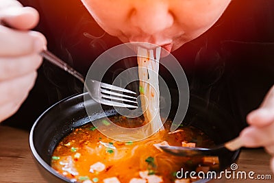 Man eating very hot and spicy noodle tasty yummy Stock Photo