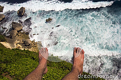 Man at the edge of cliff Stock Photo