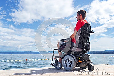 Man on electric wheelchair Stock Photo