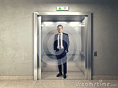 Man in elevator Stock Photo