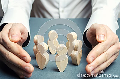 A man embraces a circle of human figures. Care and protection, insurance team. Patronage of communities and groups. Creating Stock Photo