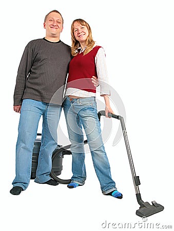 Man embraces woman with vacuum cleaner Stock Photo