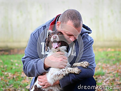 Man embracing his dog Stock Photo