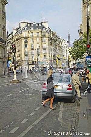 Man emerging from taxi on street, Paris, France Editorial Stock Photo