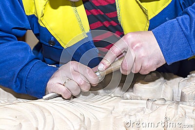 Man engaged in woodcarving Stock Photo