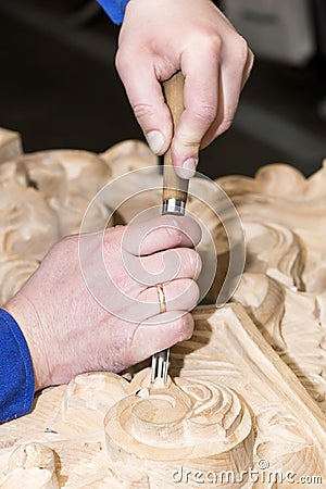 Man engaged in woodcarving Stock Photo