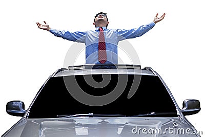 Man enjoy freedom on the sunroof of car Stock Photo