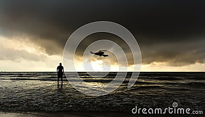 Man enjoying gloomy sunset at Gokarna beach, Karnataka Stock Photo