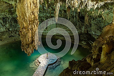 Man enjoying the view of Suytun Cenote from the top Yucatan Mexico North America Stock Photo