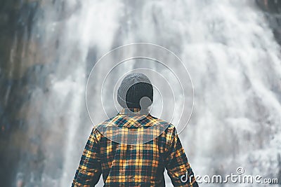 Man enjoying waterfall Travel Lifestyle adventure Stock Photo