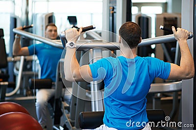 Man exercising on a simulator for dorsi Stock Photo