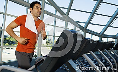 Man Exercising On Treadmill In Gym Stock Photo