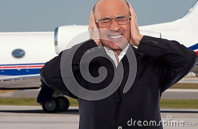 Man expressing stress and noise at the airport Stock Photo