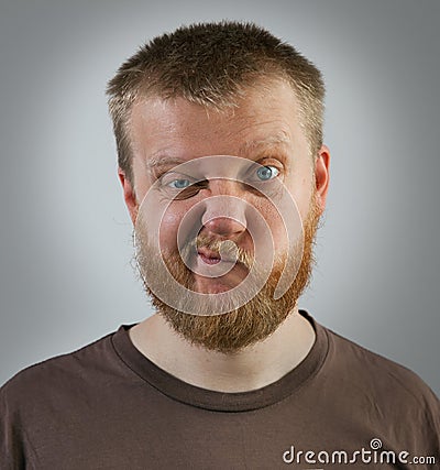 Man with an expression of discontent on his face Stock Photo