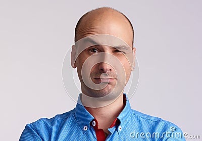 Man face with raised eyebrow Stock Photo