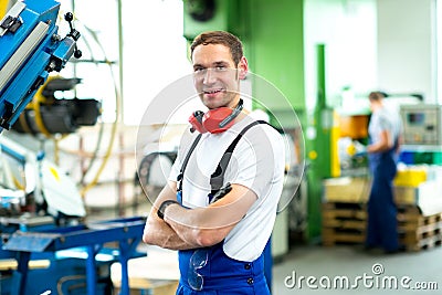 Man in factory Stock Photo