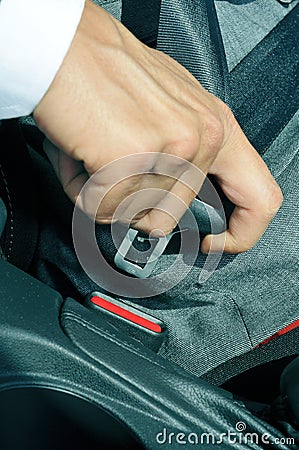 Man fastening the car safety belt Stock Photo