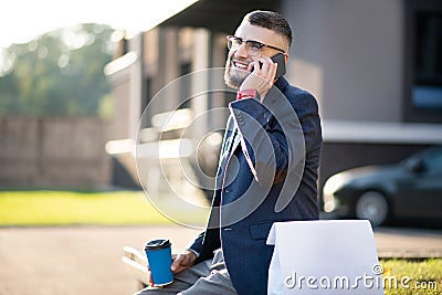 Cheerful man feeling happy receiving call from old friend Stock Photo