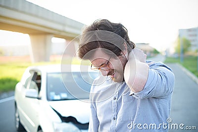 Man feeling pain to the neck after car crash Stock Photo