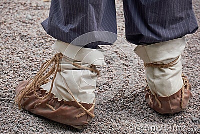 Man feet in national Russian leather shoes postol Stock Photo