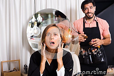 Man with female visitor shocked Stock Photo