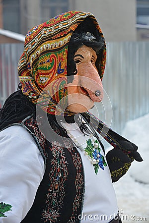 Man in a festive costume and woman mask Editorial Stock Photo