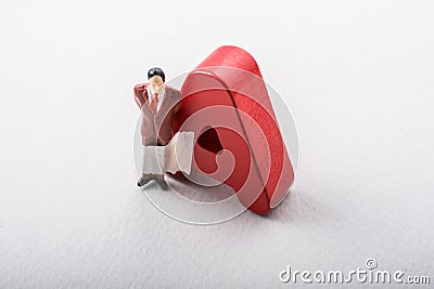 Man figurine attached and Letters of A on white Stock Photo