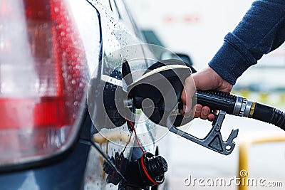 Man is filling tank of his car on the gas station Stock Photo