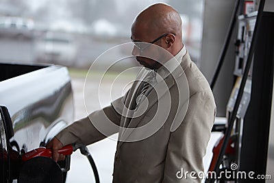 A man fills his fuel tank Stock Photo