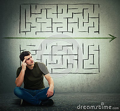 Man find a solution to solve problem and escape from labyrinth Stock Photo