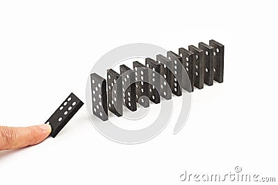 Man finger holding a piece of domino Stock Photo