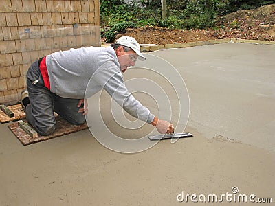 Man finishing concrete slab Stock Photo