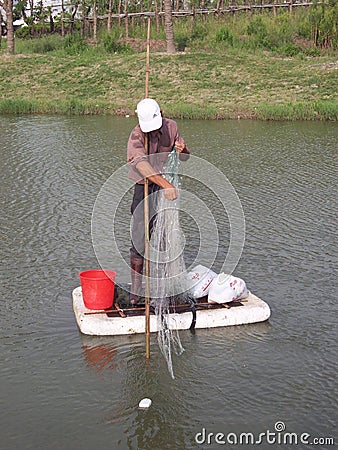 Chinese Man fishing Editorial Stock Photo