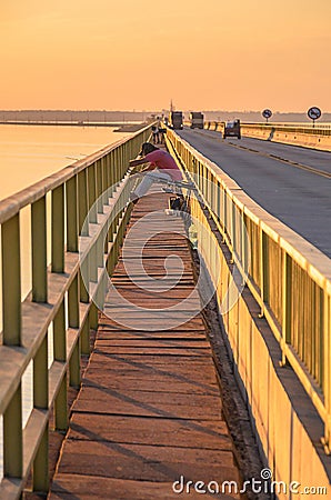 Man fishing on the Helio Serejo bridge Editorial Stock Photo