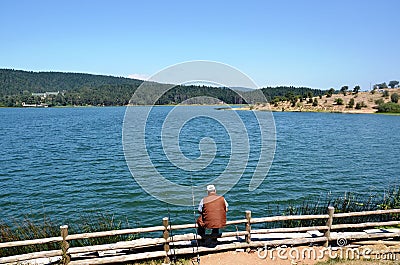 The man fishing at the lakeside Editorial Stock Photo