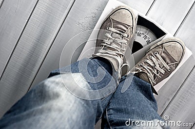 Man on floor scale Stock Photo