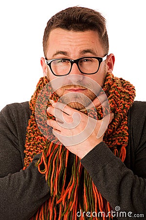 Man with flu and fever wrapped in scarf has terrible sore throat Stock Photo