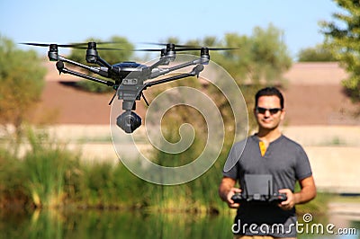 Man Flying a High-Tech Camera Drone Stock Photo