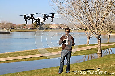 Man Flying a High-Tech Camera Drone Stock Photo