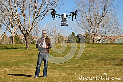 Man Flying a High-Tech Camera Drone Stock Photo