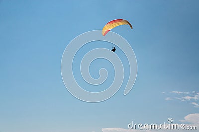 man flying on paraglider blue sky on background Ukraine Crimea Stock Photo