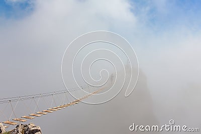 Man in fog over chasm Stock Photo