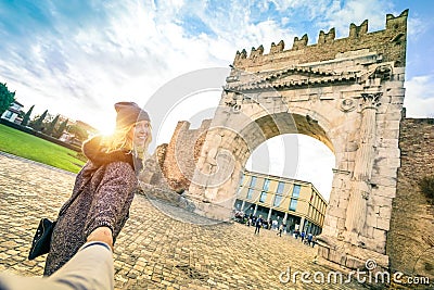 Man following beloved woman on autumn vacation - Fun concept Stock Photo