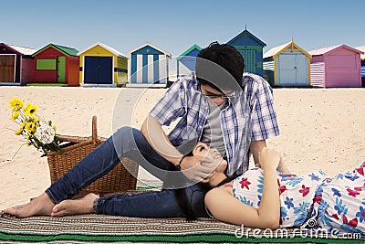 Man fondle his girlfriend at beach Stock Photo
